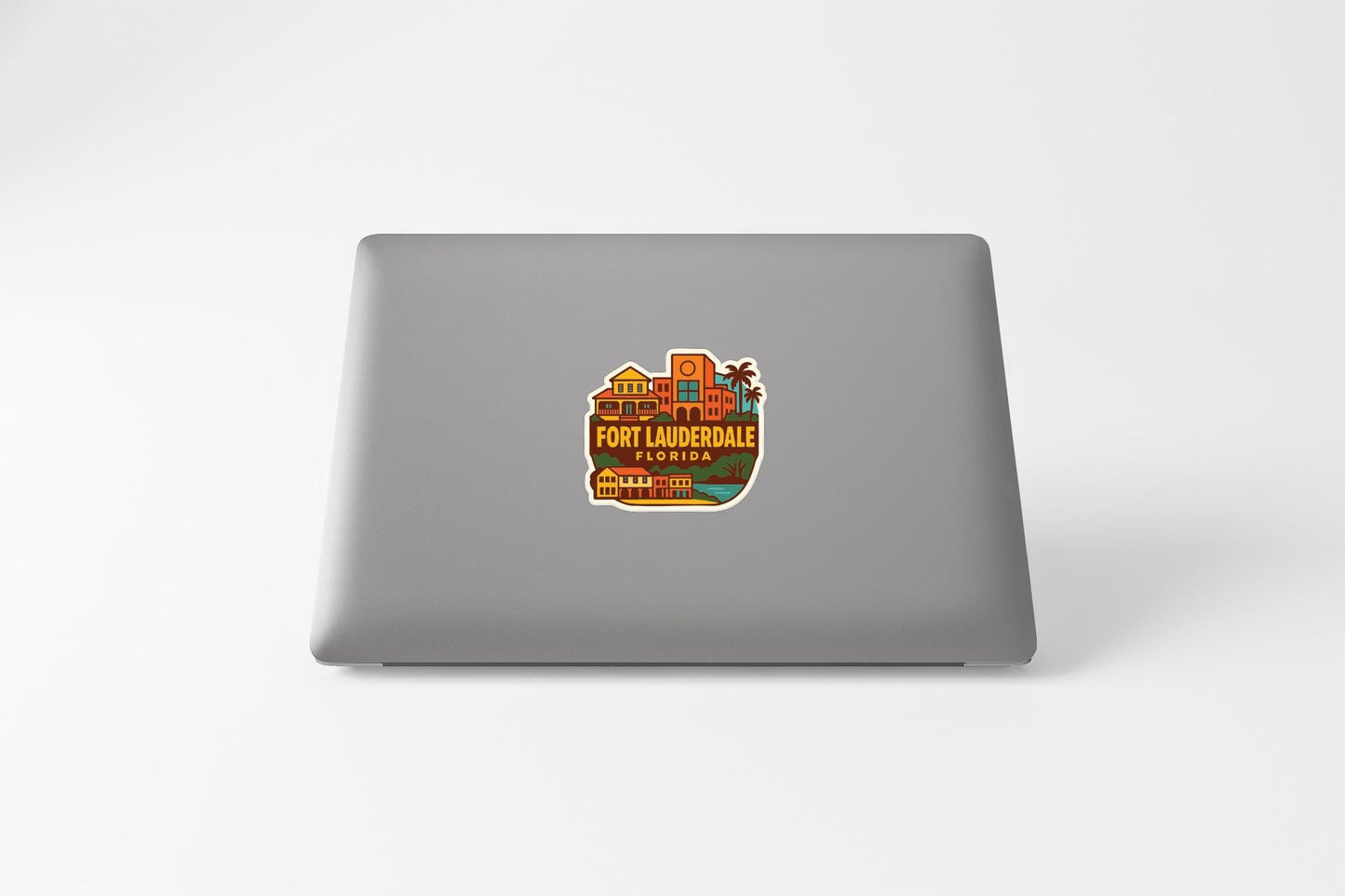 a sticker or decal of Fort Lauderdale, Florida, on the back of a laptop computer.