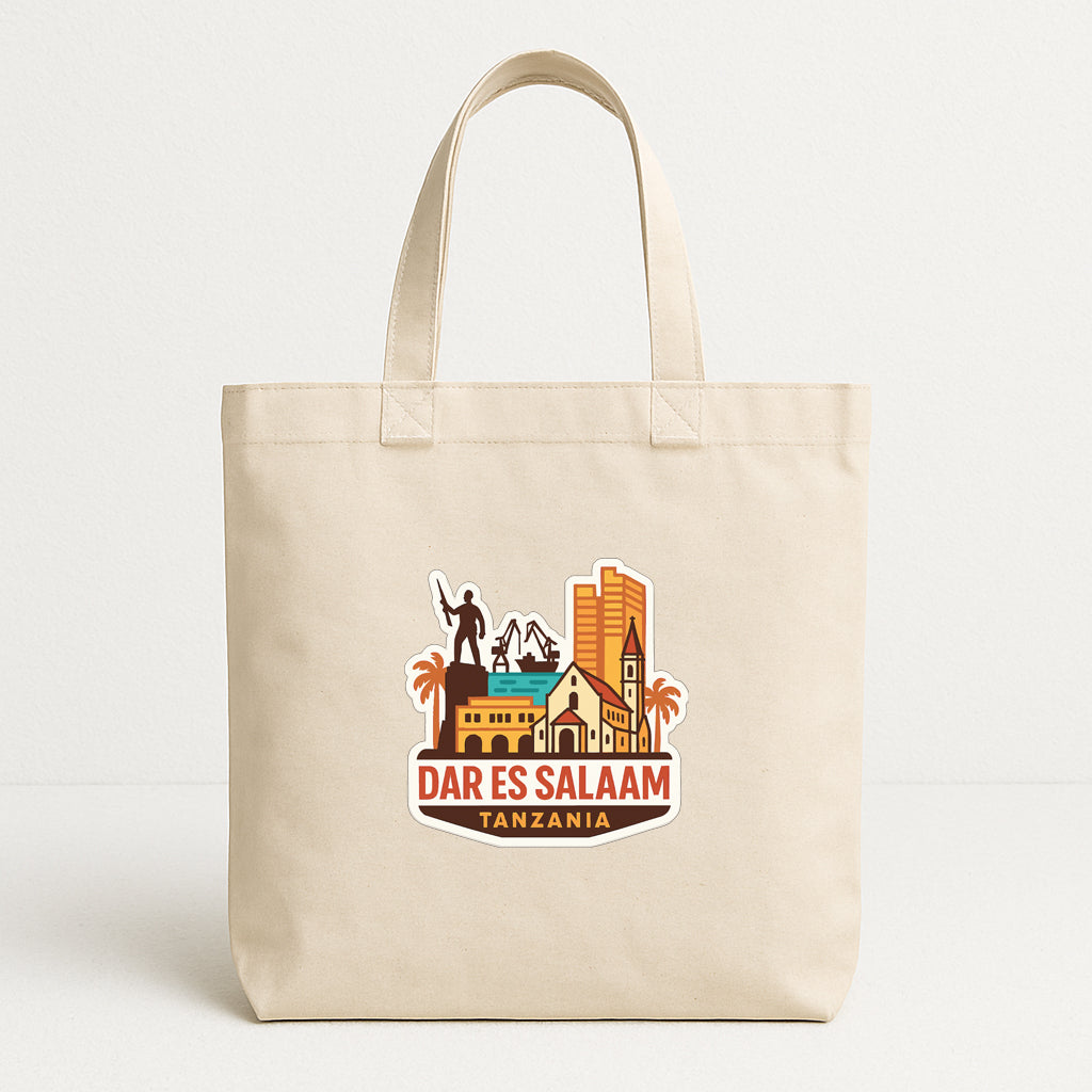 A beige tote bag with a printed design depicting a city skyline and the text "DAR ES SALAAM TANZANIA".