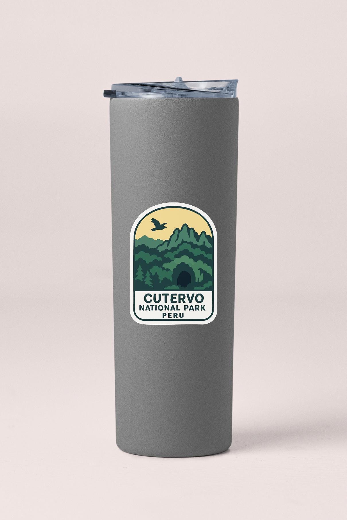 A gray cylindrical thermos with a label that says "CUTERVO NATIONAL PARK PERU".