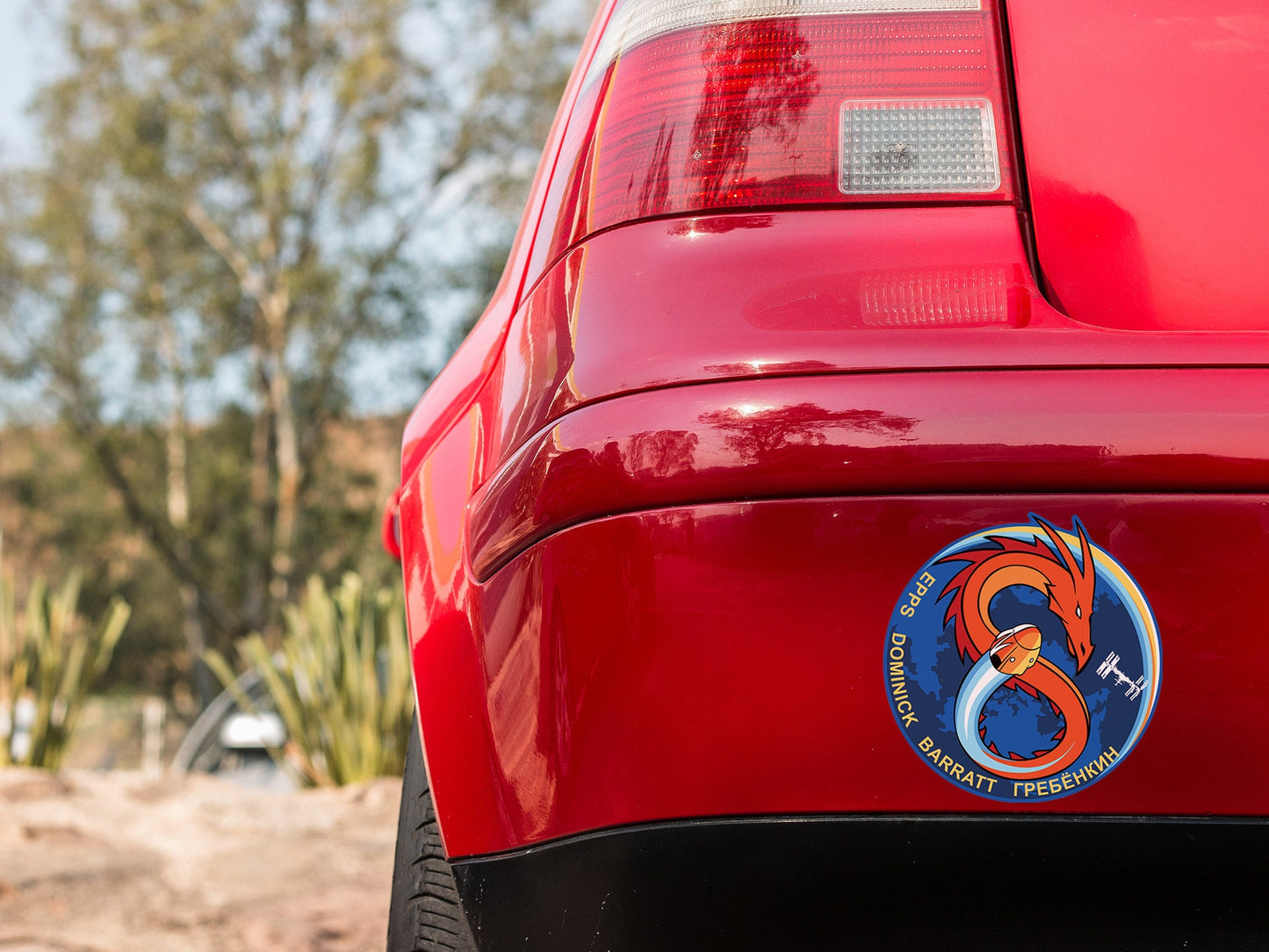 a close up of the tail end of a red car