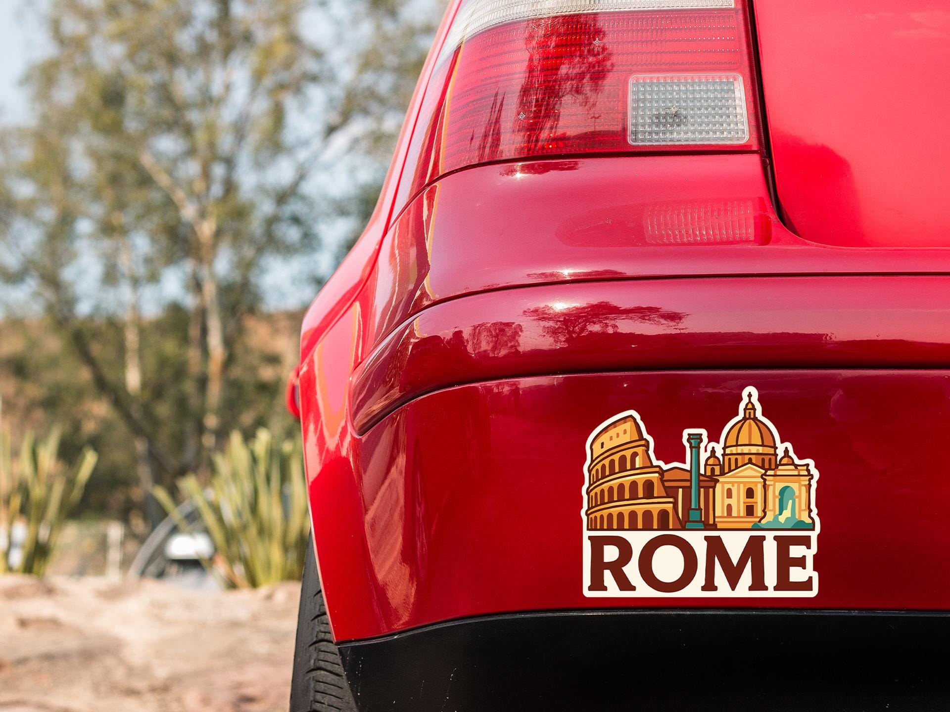 a red car with a sticker on the back of it