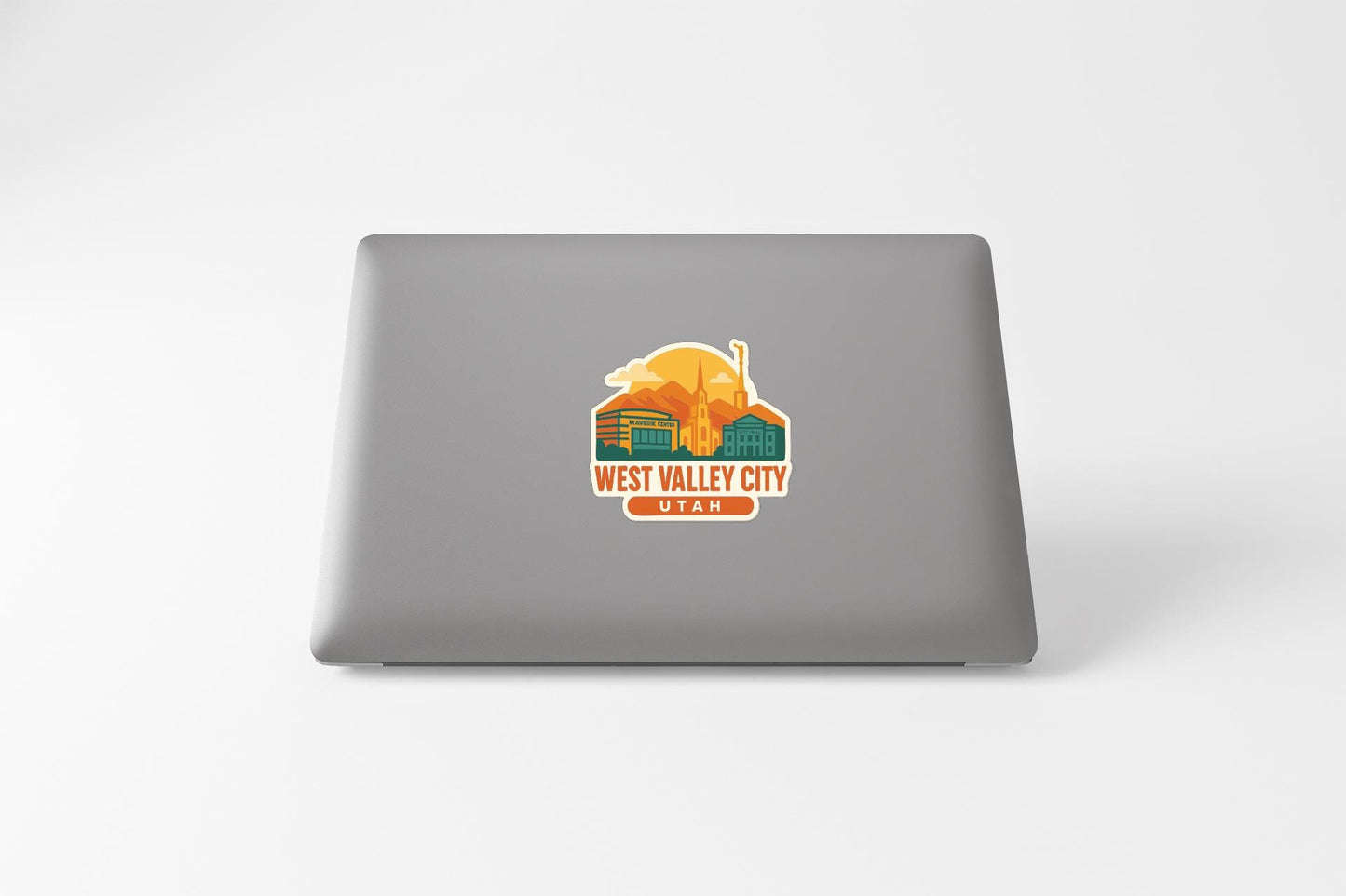 a sticker on the back of a laptop that says "WEST VALLEY CITY UTAH".