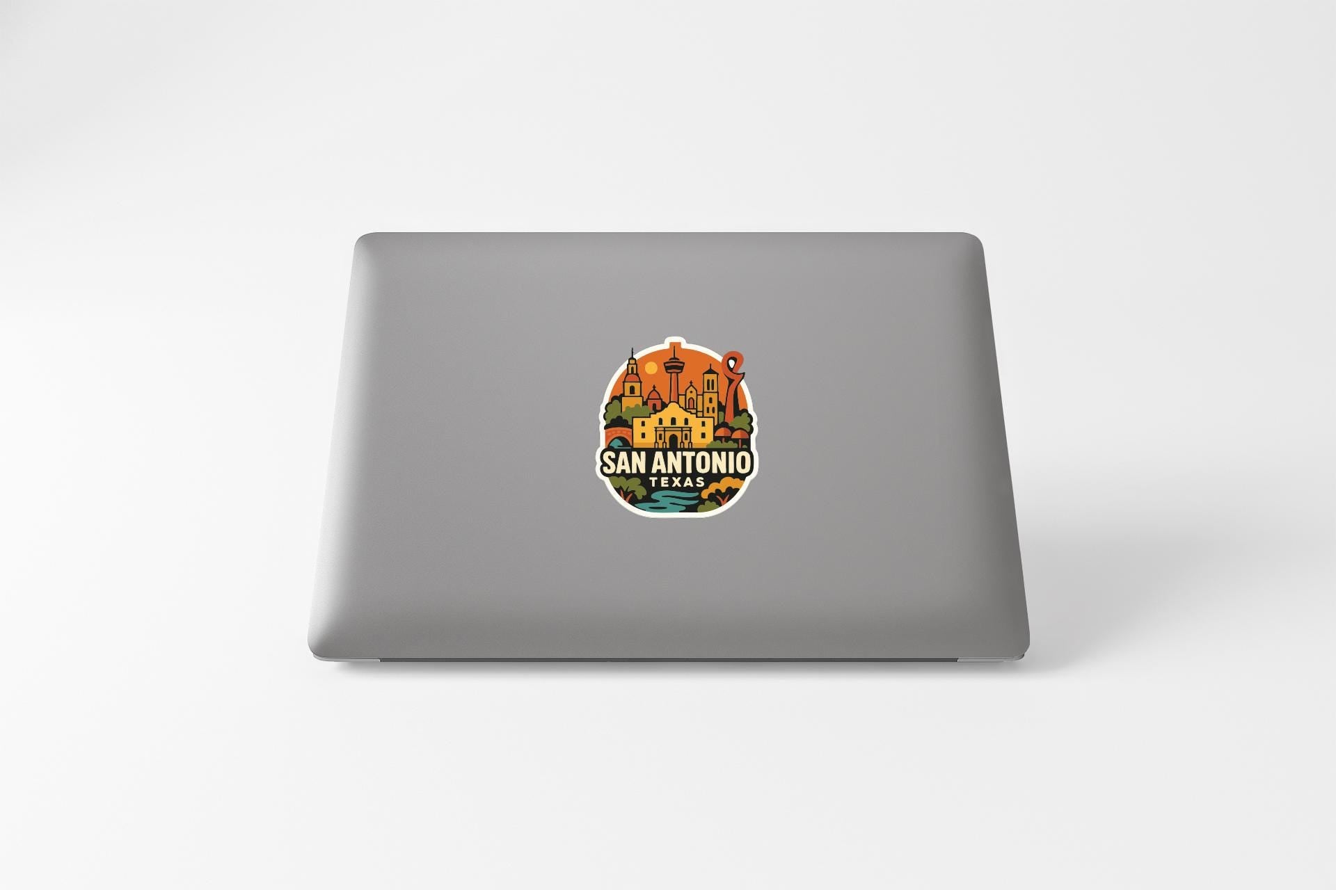 a sticker with a colorful illustration of a landmark, likely representing San Antonio, Texas.