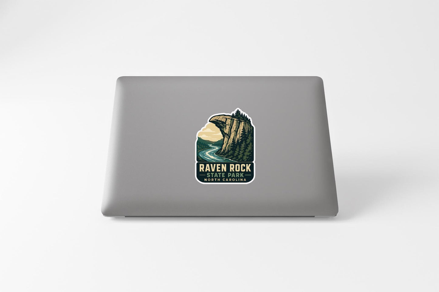 a sticker on the back of a laptop that says "RAVEN ROCK" and "NORTH CAROLINA".