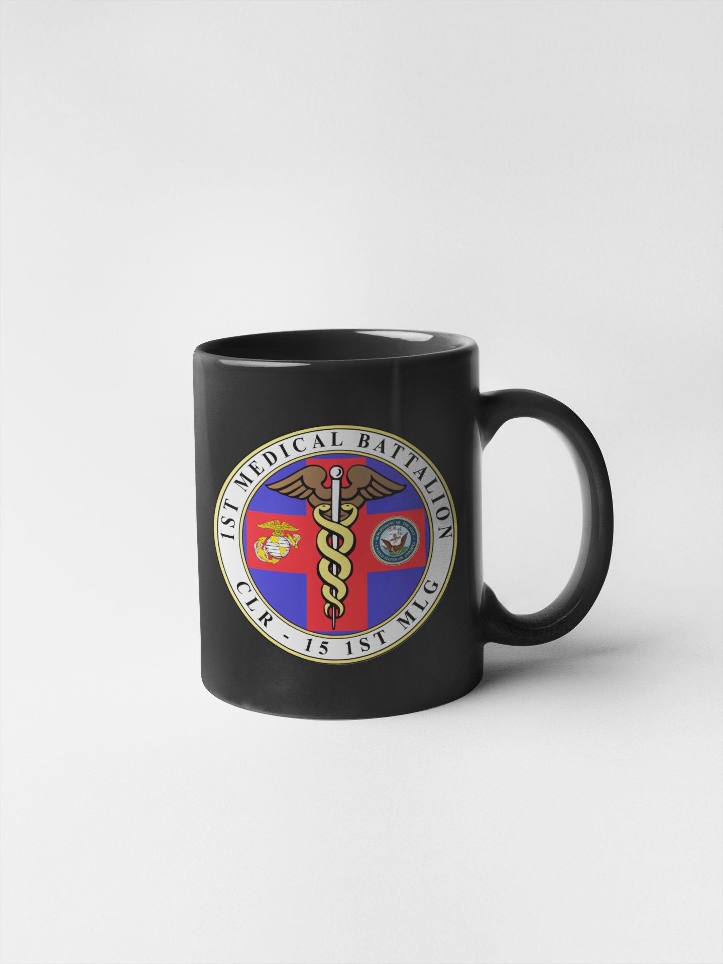 a black mug with a medical emblem on it