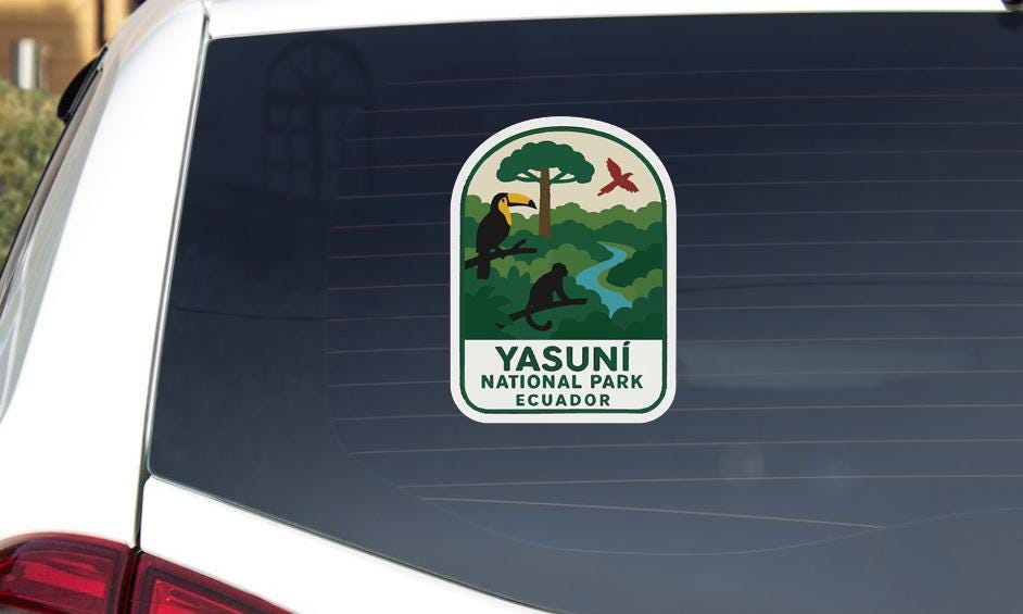 a sticker on the rear window of a car, displaying the logo and name of Yasuni National Park in Ecuador.