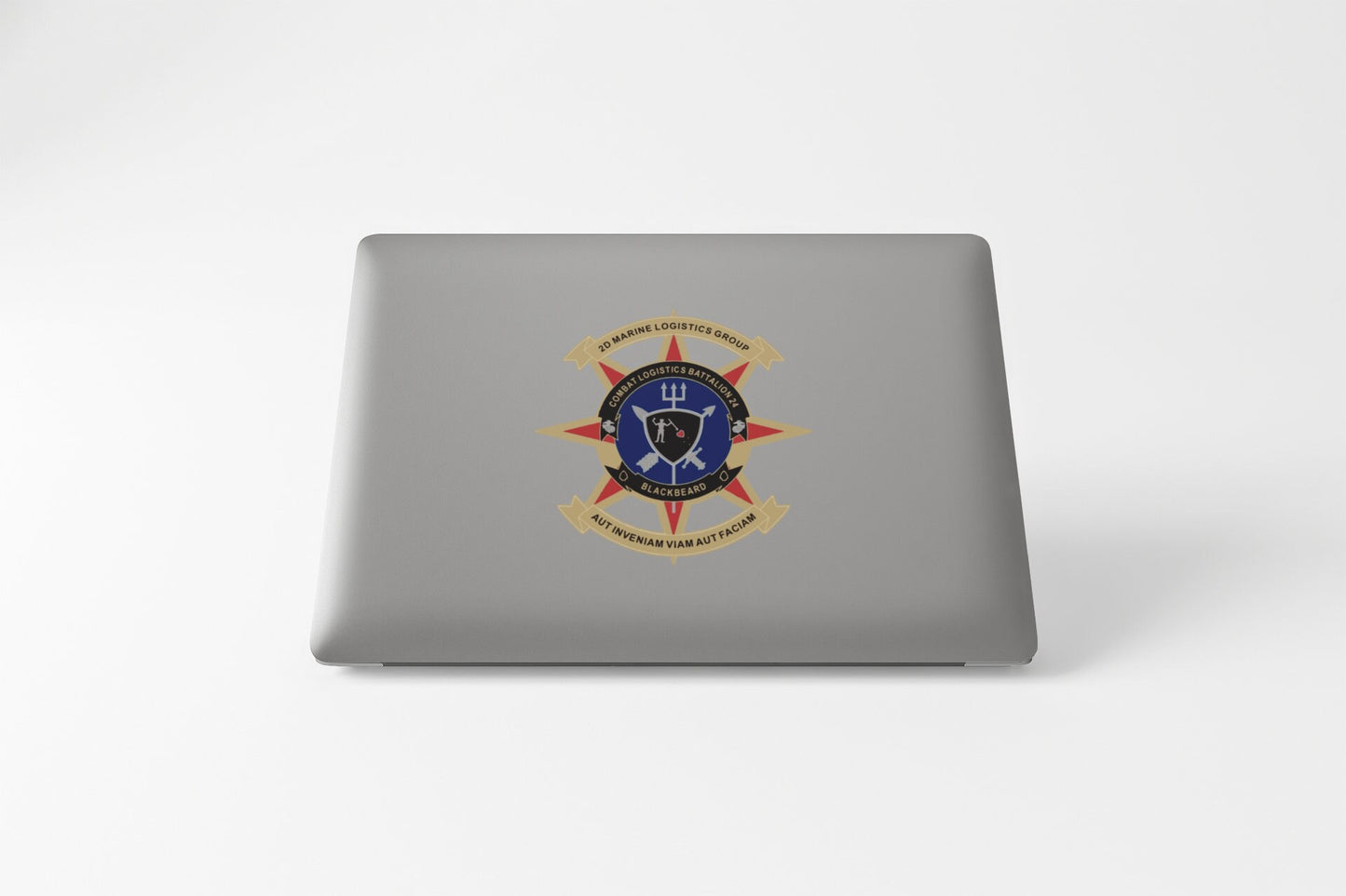 a laptop with a picture of a shield and swords on it