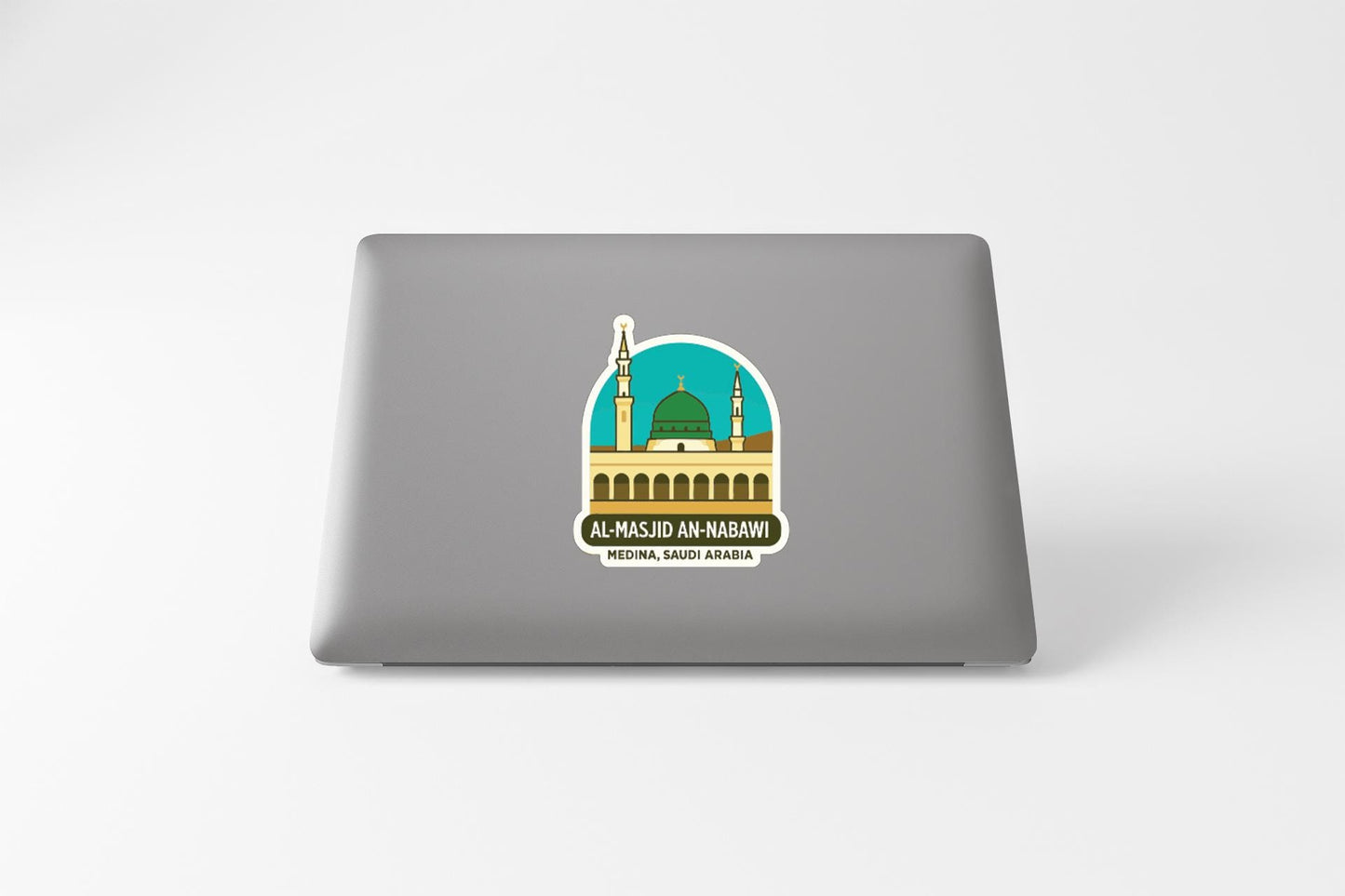 A sticker depicting the Al-Majid Al-Nabawi Mosque in Saudi Arabia, with a green dome and minaret.