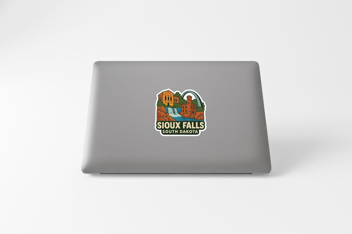 a sticker on the back of a laptop that says "SIoux Falls South Dakota".