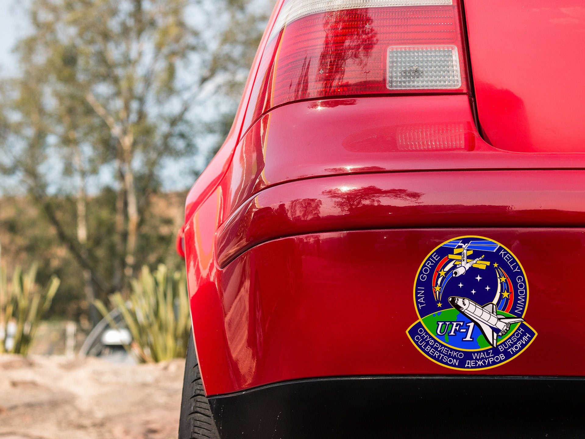 a close up of the back of a red car