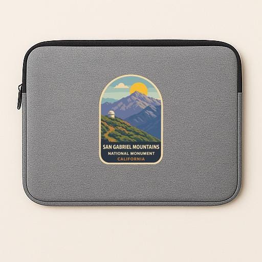 A gray laptop sleeve with a San Gabriel Mountains National Monument logo printed on it.