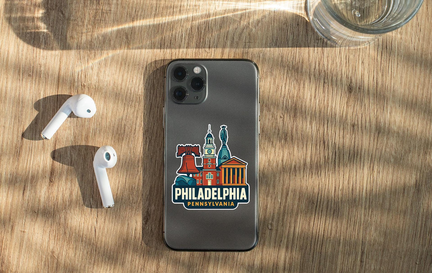 a phone and ear buds sitting on a table