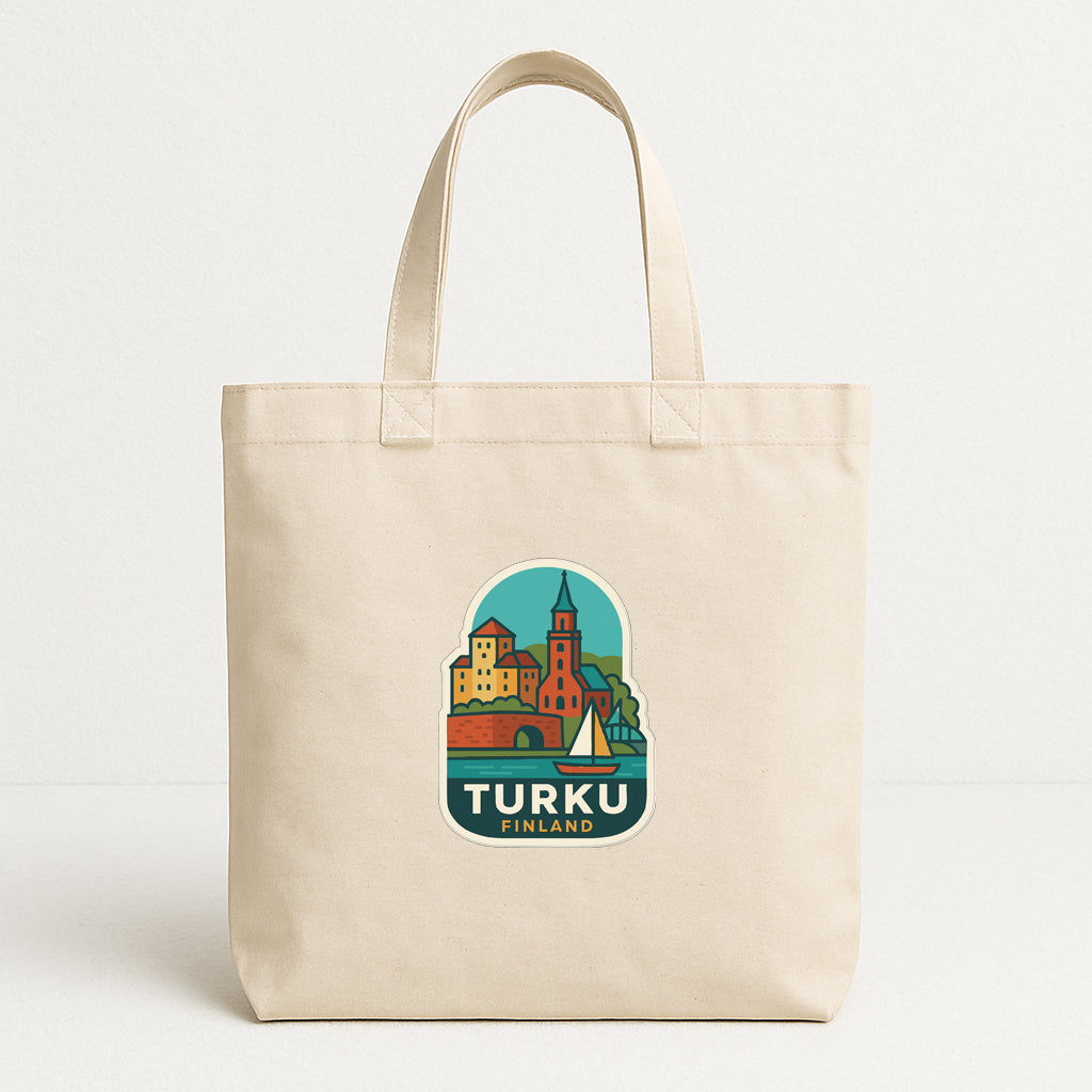 A beige tote bag with a printed design depicting a cityscape and the text "TURKU FINLAND" printed on it.
