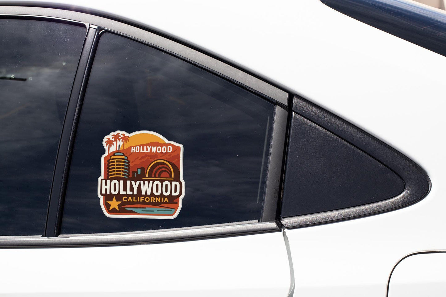 A sticker on the side of a car window that says "Hollywood California".