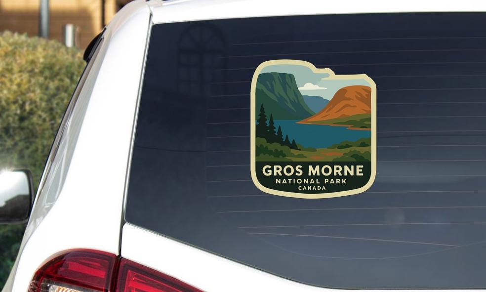 A sticker on the rear window of a vehicle that says "Gros Morne National Park Canada".