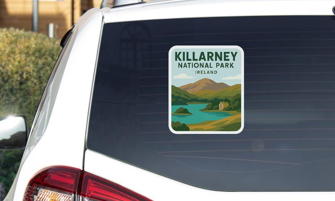 a sticker on the rear window of a car that says "KILLARNEY NATIONAL PARK IRELAND".