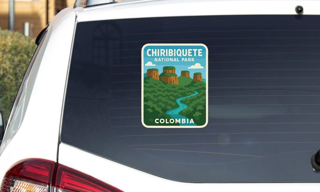 A sticker on the rear window of a car that says "CHIBIQUOTE NATIONAL PARK COLOMBIA".