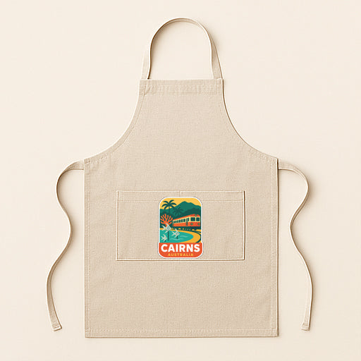 A beige apricot with a graphic of a tropical island and the text "CAIRNS, AUSTRALIA" printed on it.