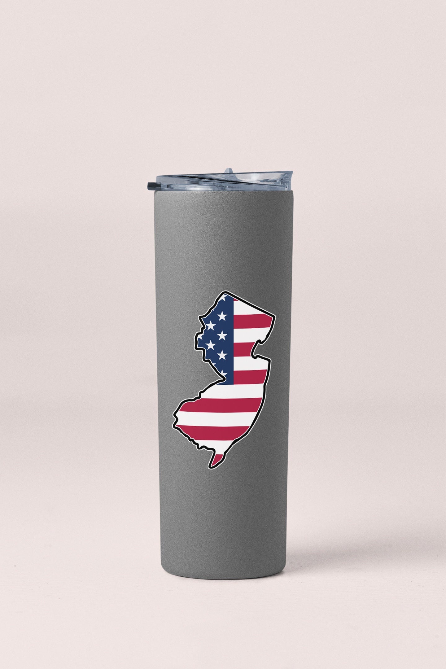 a stainless steel tumbler with the shape of the united states of america painted on