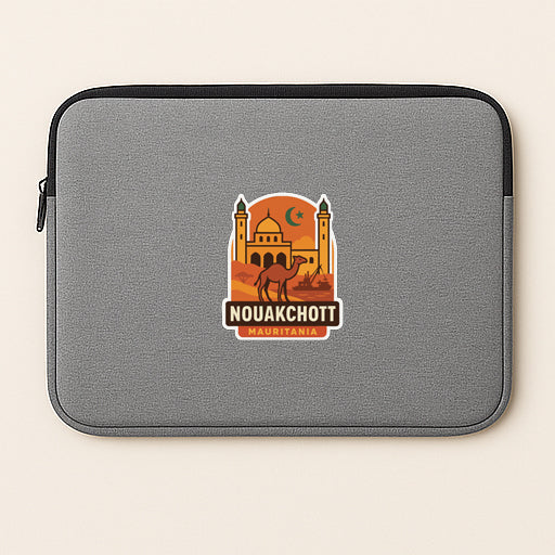 a gray laptop sleeve with a sticker depicting a camel and a building, along with the text "NOUAKCHOTT MAURITAIN".