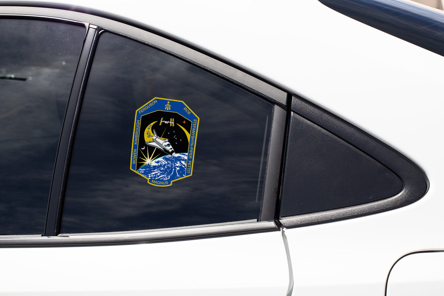 a close up of a car window with a sticker on it