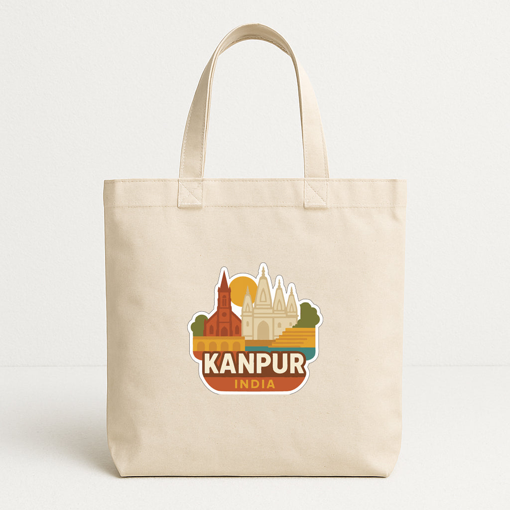 A beige tote bag with a sticker depicting the city of Kanpur, India.