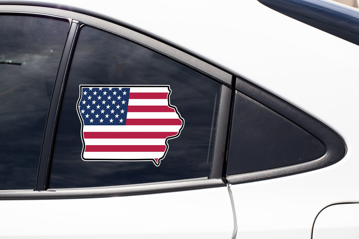 an american flag sticker on a car window