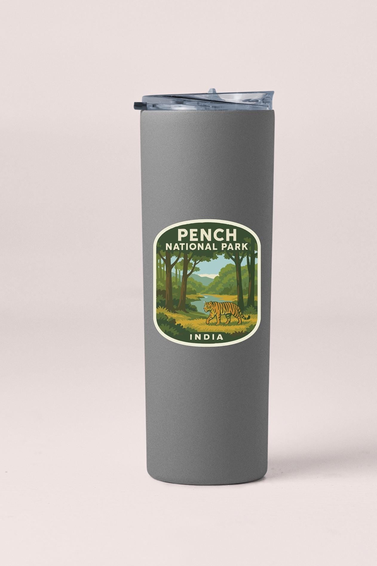 A gray tumbler with a label that says "PENCH NATIONAL PARK INDIA".