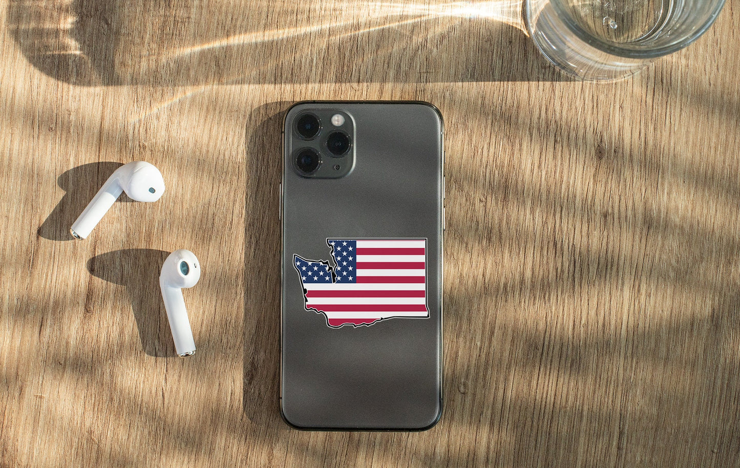 a cell phone with a sticker of the state of texas on it