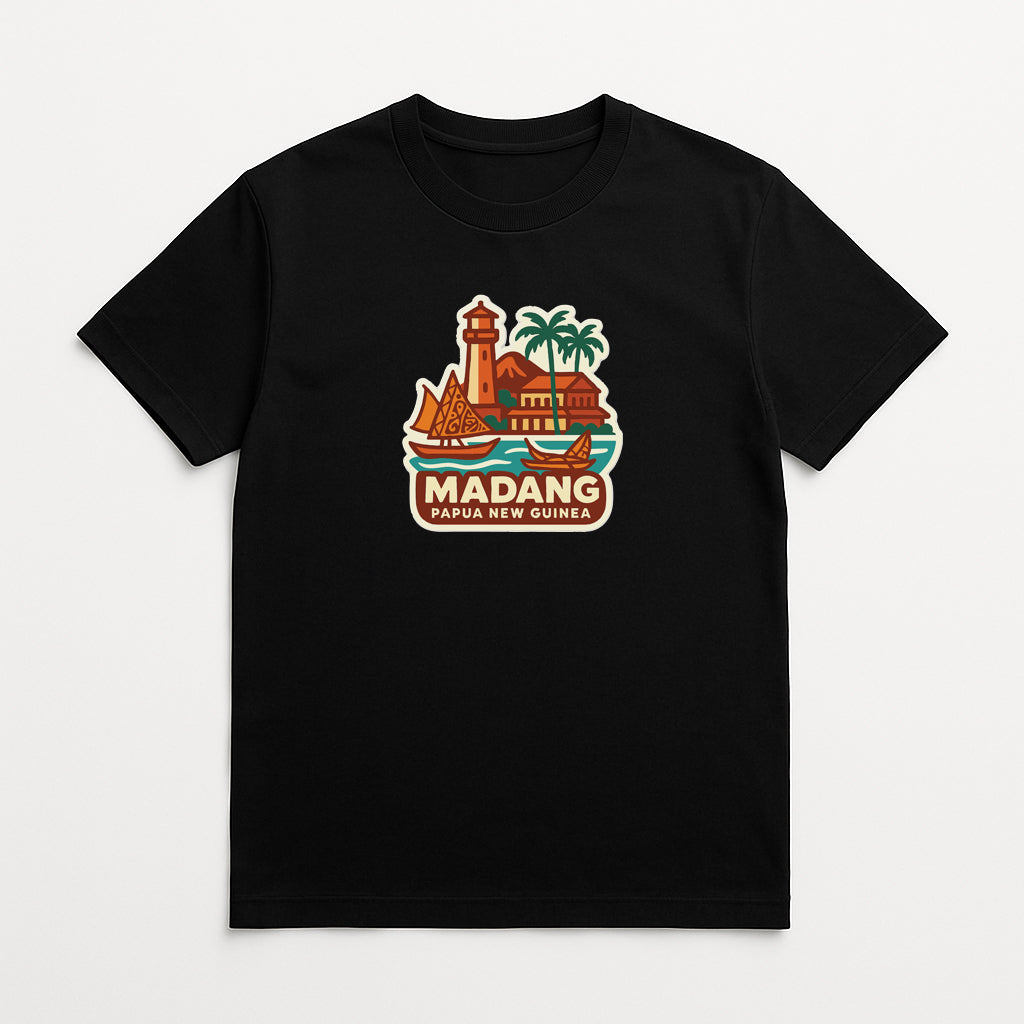 A black t-shirt with a graphic design depicting a lighthouse, palm trees, and a building, along with the text "MADANG Papua New Guinea".