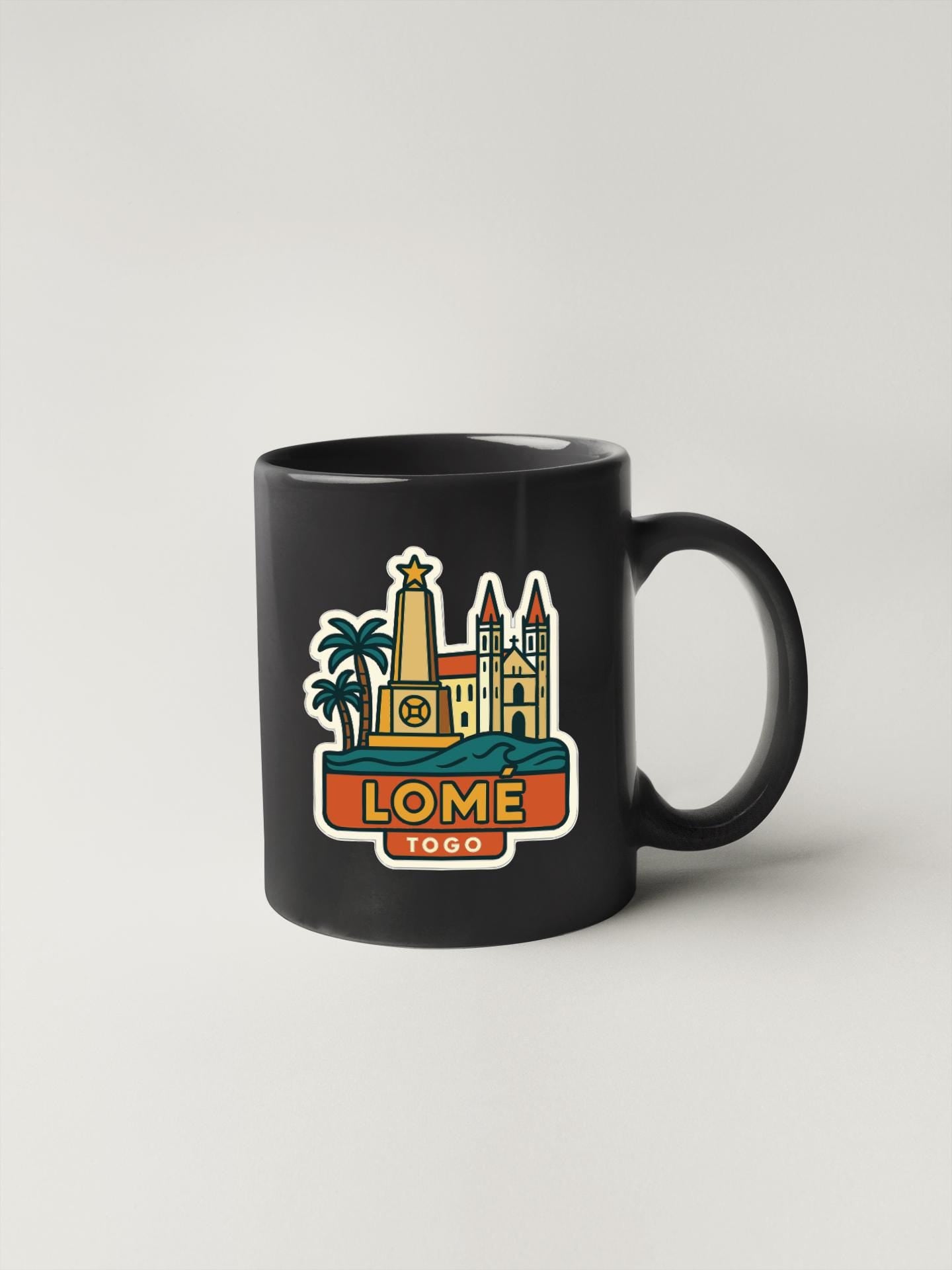 A black coffee mug with a colorful illustration of a city skyline and the text "LOME" and "1950" printed on it.