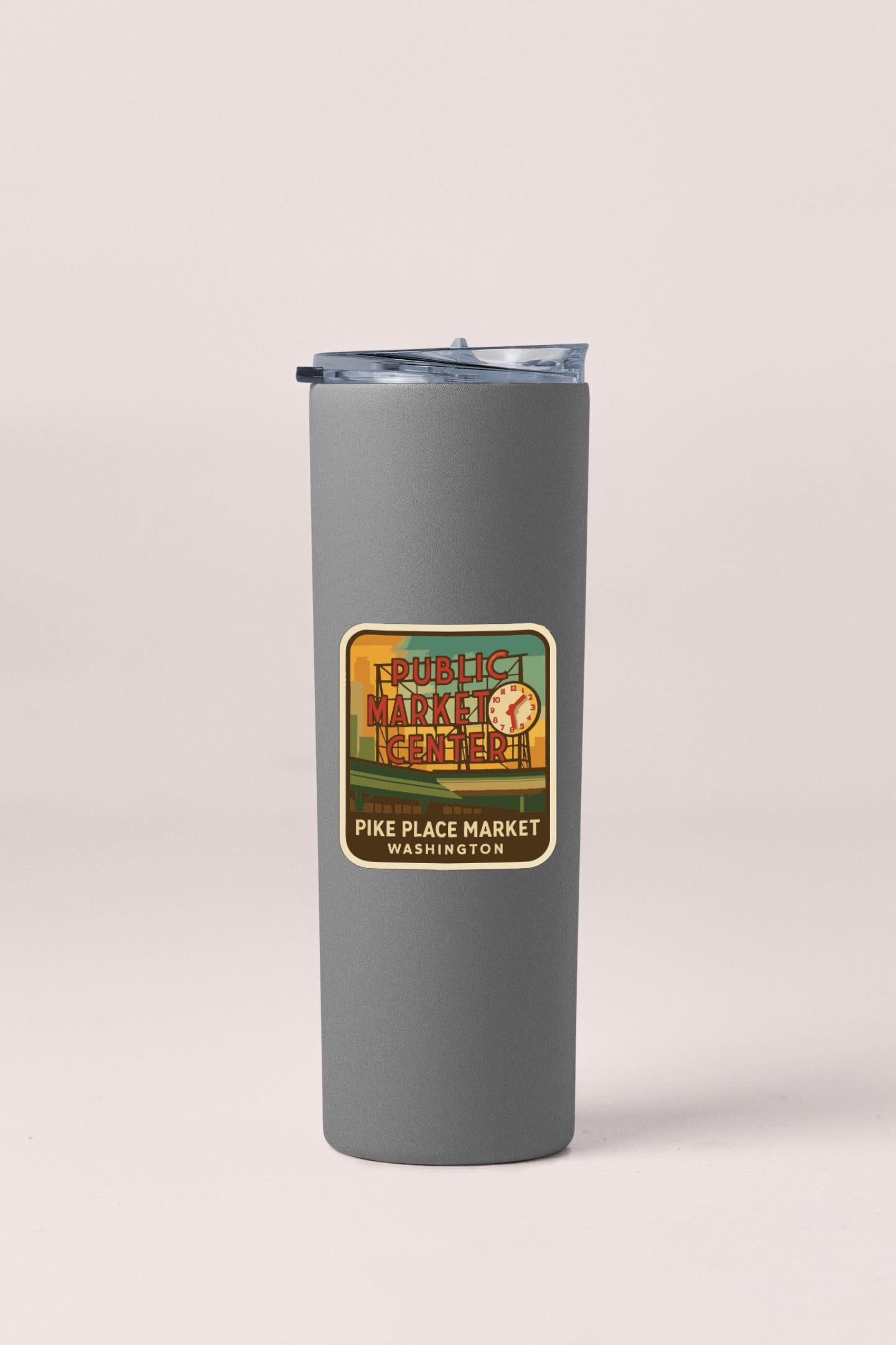 A gray insulated tumbler with a label that says "PUBLIC MARKET CENTER PIKE PLACE MARKET WASHINGTON".