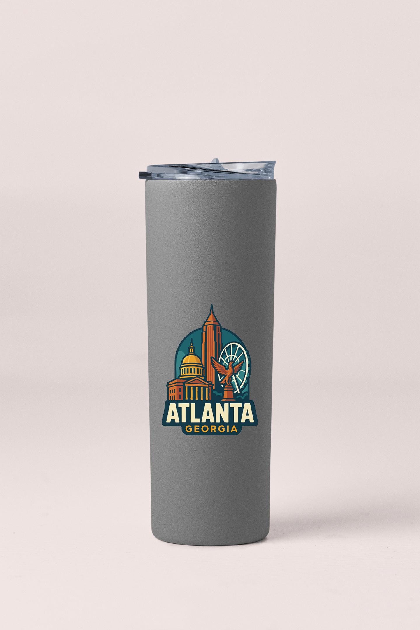 a travel mug with a picture of the atlanta skyline