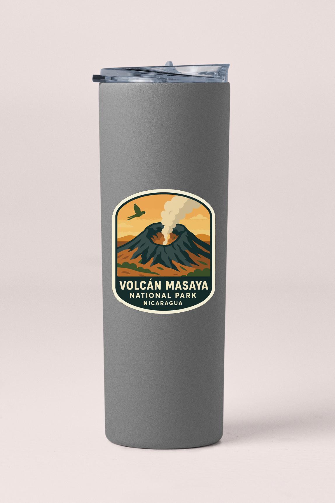 A gray tumbler with a label that says "Volcan Masaya National Park Nicaragua" and features an illustration of a volcano with smoke rising from it.