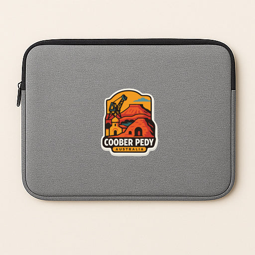 a gray laptop sleeve with a logo of the town of Cooper Pedy, Australia.