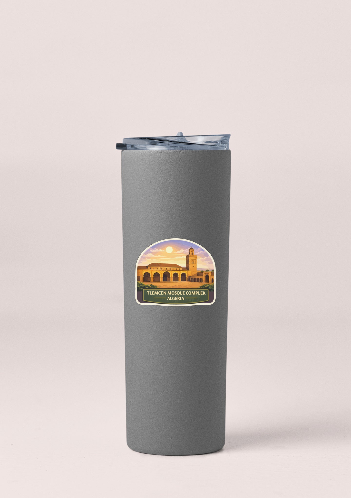 A gray insulated tumbler with a sticker depicting the Tlemacen Mosque Complex in Algeria.