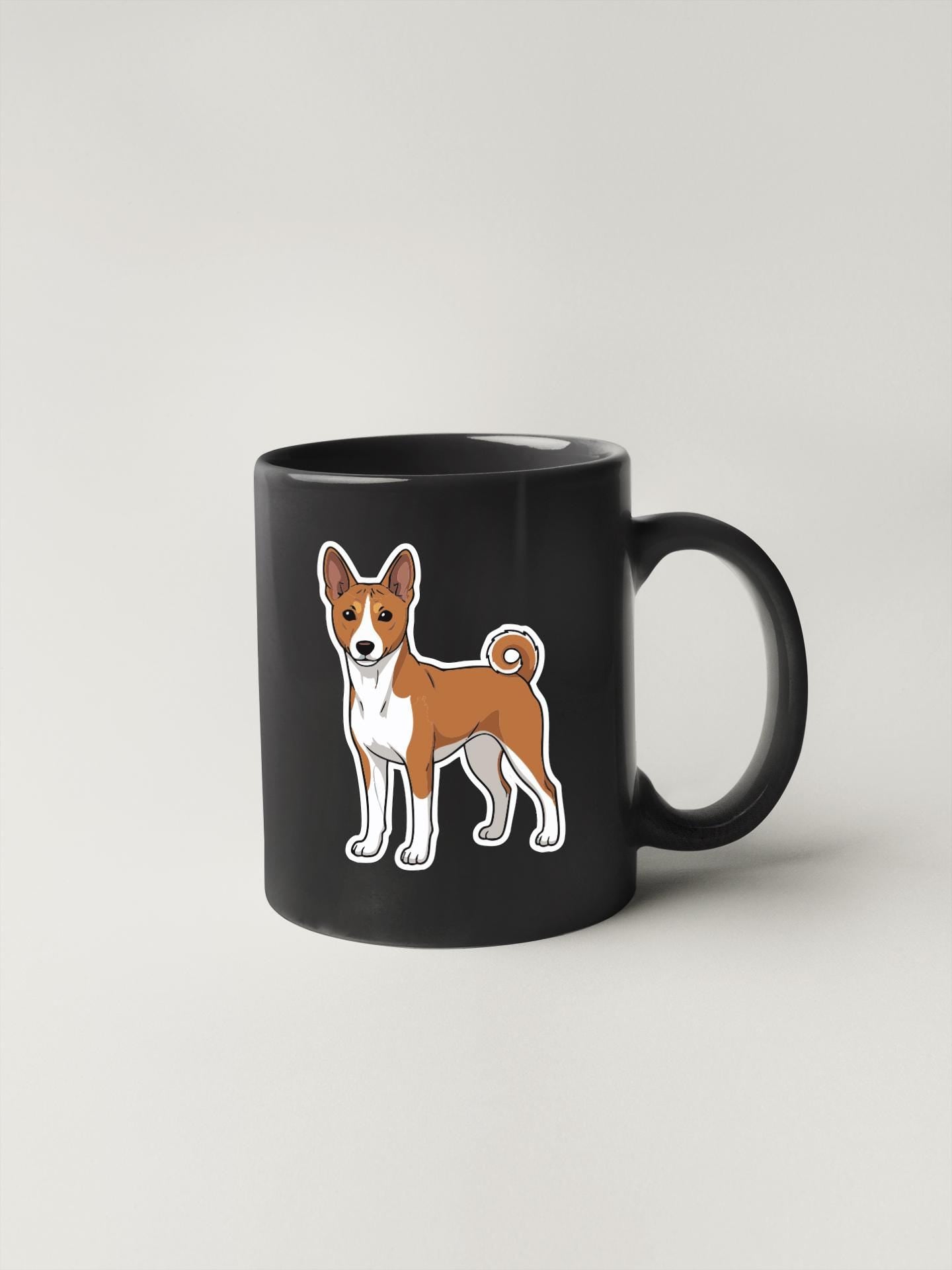 A black mug with a cartoon illustration of a dog on it.