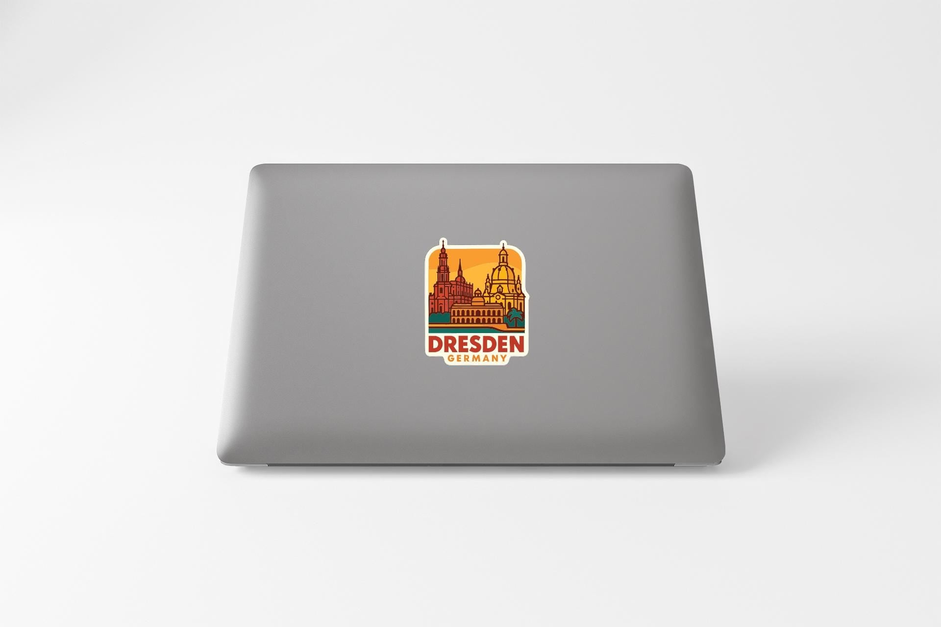 a sticker of Dresden, Germany, on the back of a laptop.