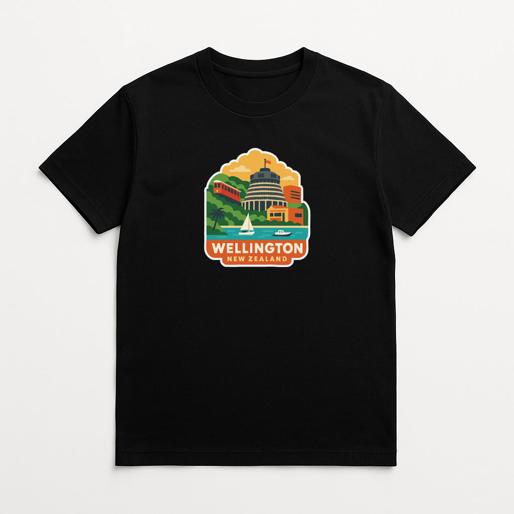 A black t-shirt with a colorful graphic design depicting a cityscape and the text "WELLINGTON NEW ZEALAND" printed on it.