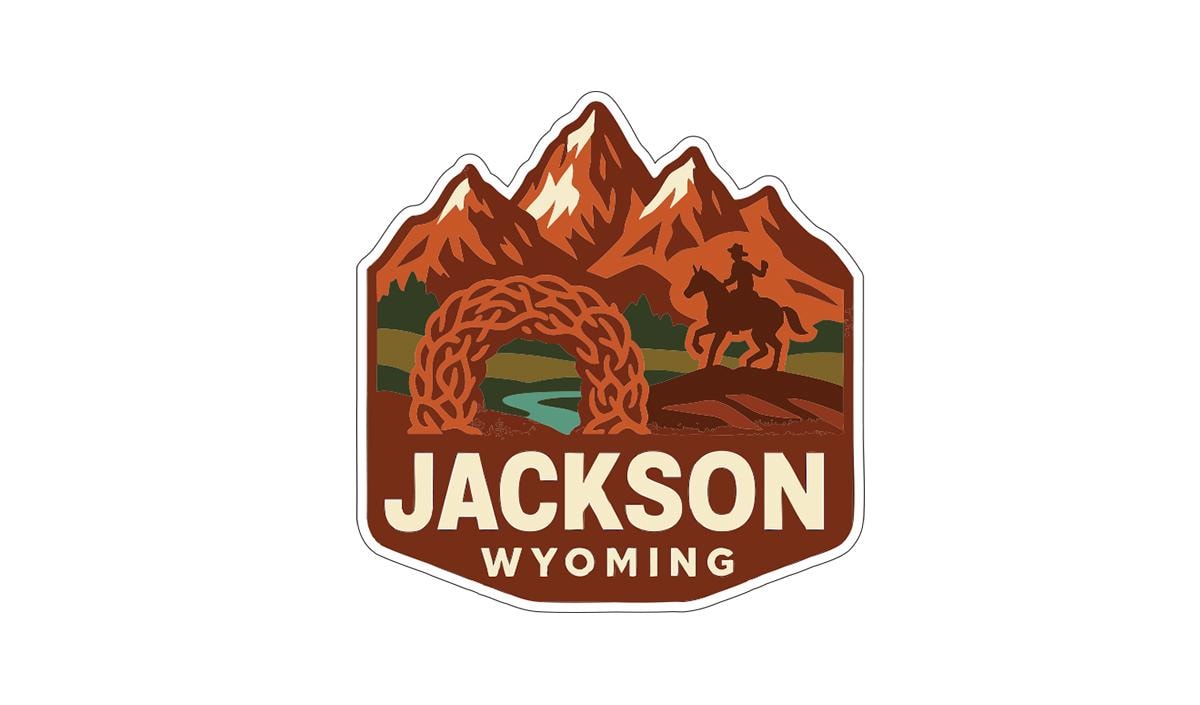 A stylized logo featuring mountains, a cowboy on horseback, and a river, with the text "JACKSON WYOMING" prominently displayed.