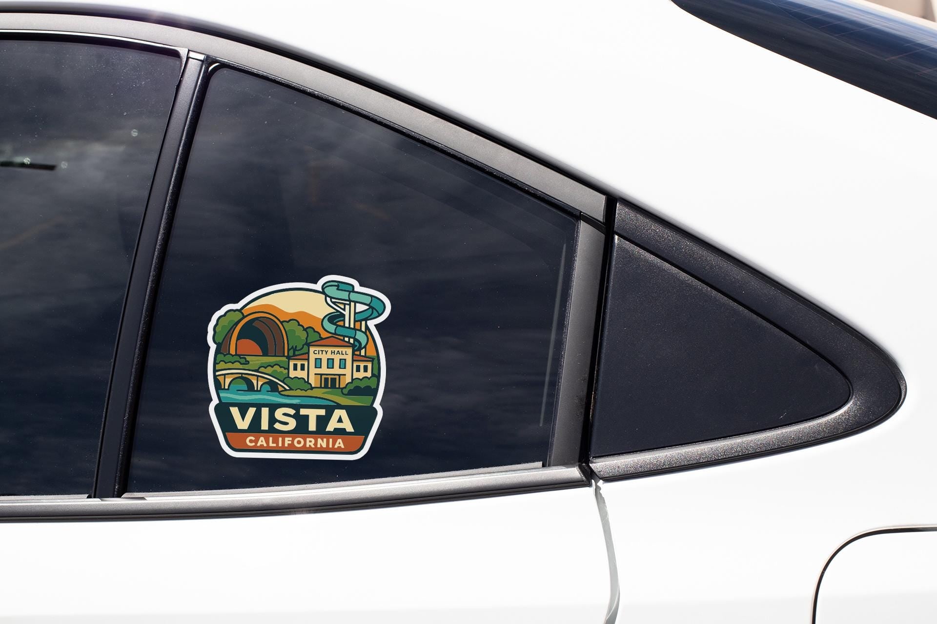 A car window with a sticker that says "Vista, California".