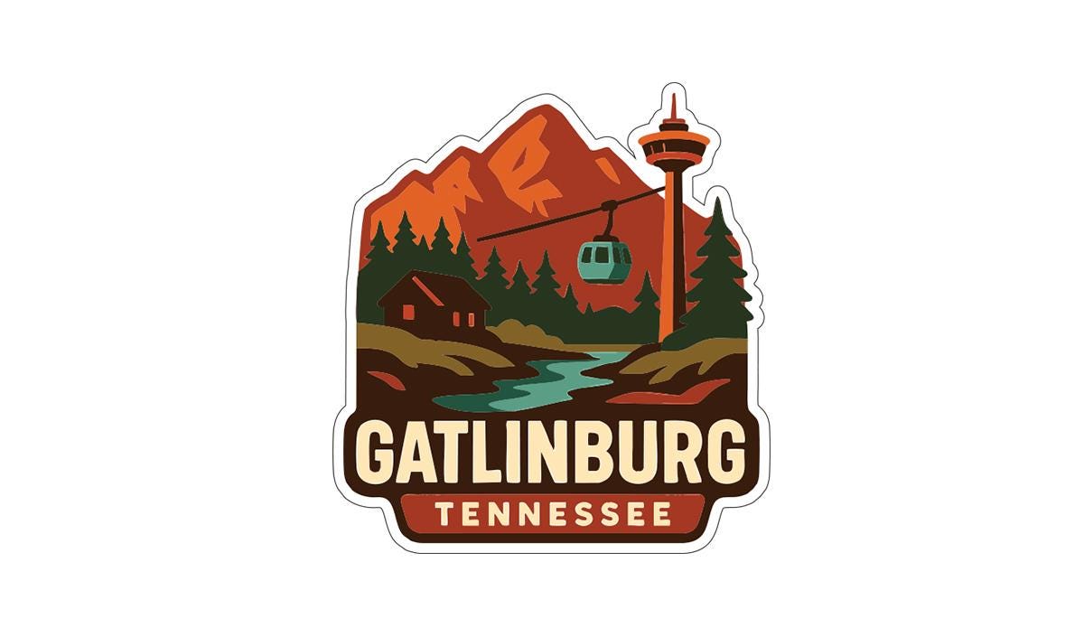 A sticker depicting a scenic landscape with mountains, a ski lift, and a cabin, with the text "GATLINBURG TENNESSEE" prominently displayed.