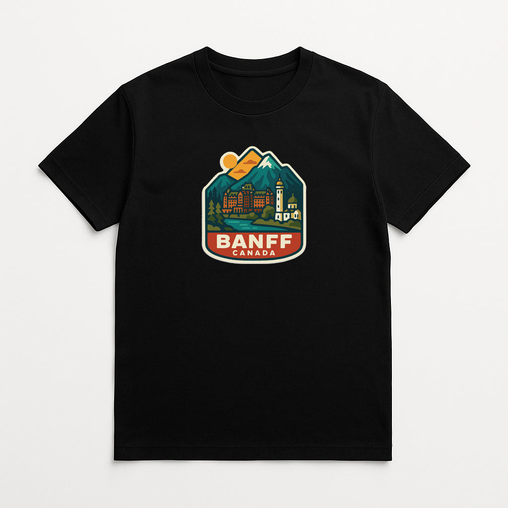 A black t-shirt with a graphic design depicting a mountain landscape and the text "BANFF CANADA" printed on it.