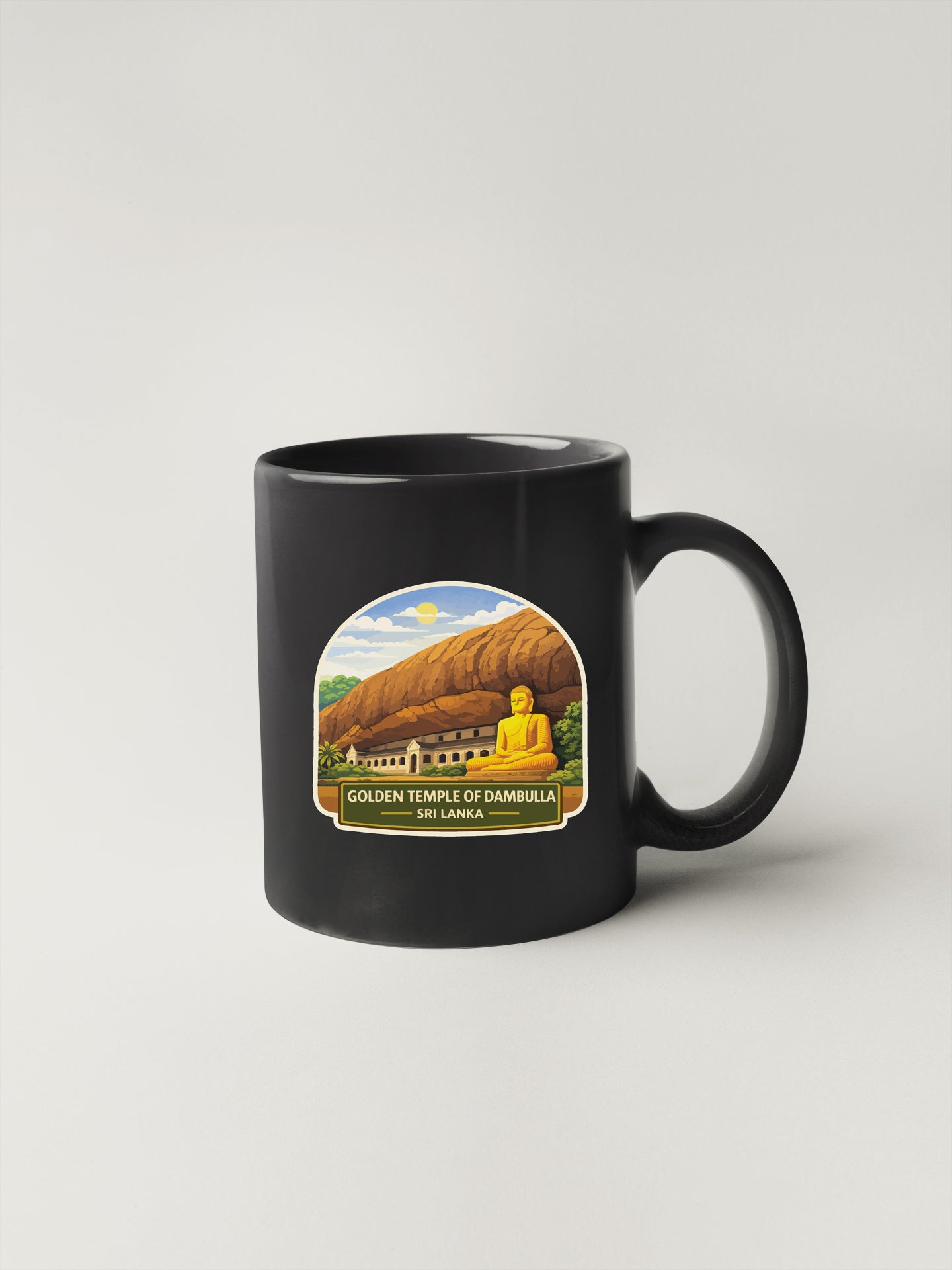 A black coffee mug with a graphic design depicting the Golden Temple of Dambulla, a famous Buddhist temple located in Sri Lanka.
