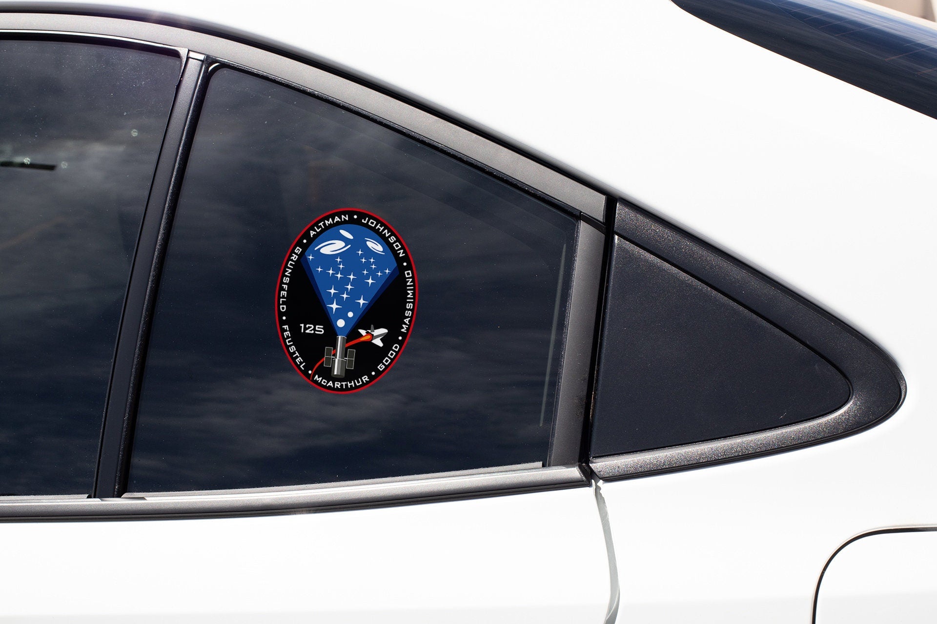 a close up of a car window with a sticker on it