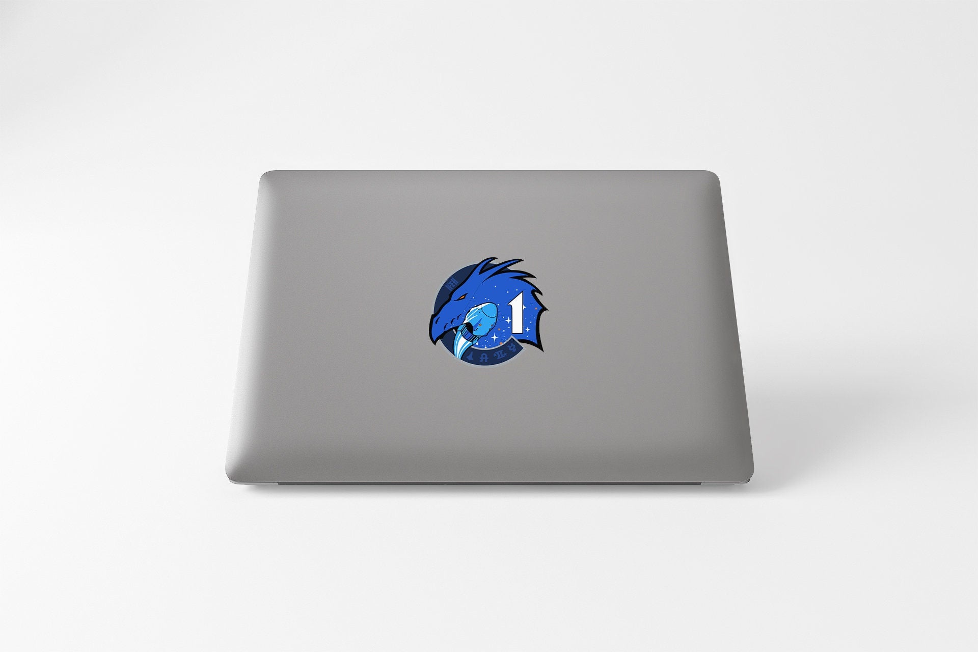 a laptop with a blue fish on it