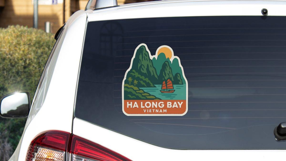 a sticker on the rear window of a car that says "HA LONG BAY VIETNAM".