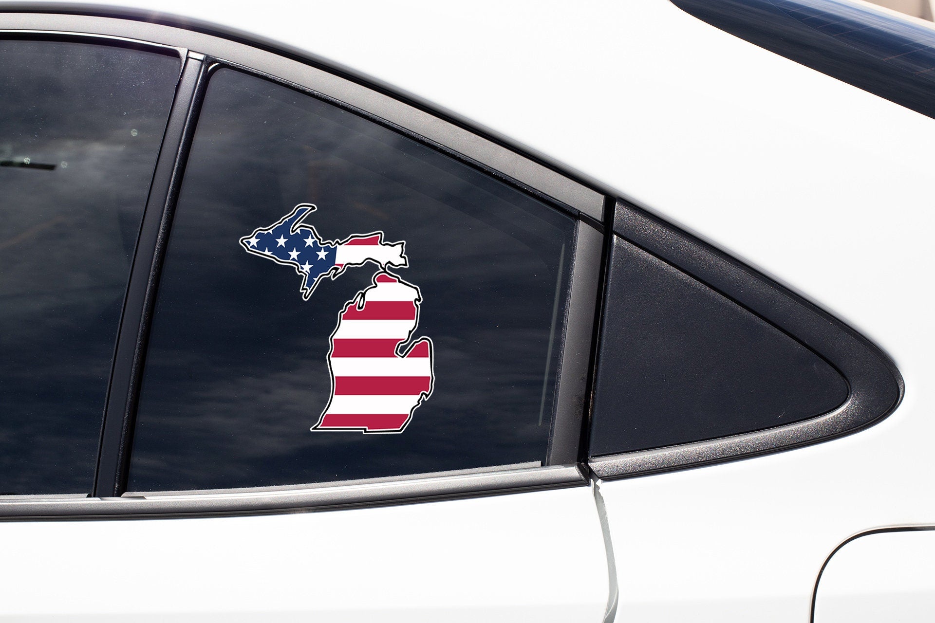 a car with a sticker of the state of michigan on it