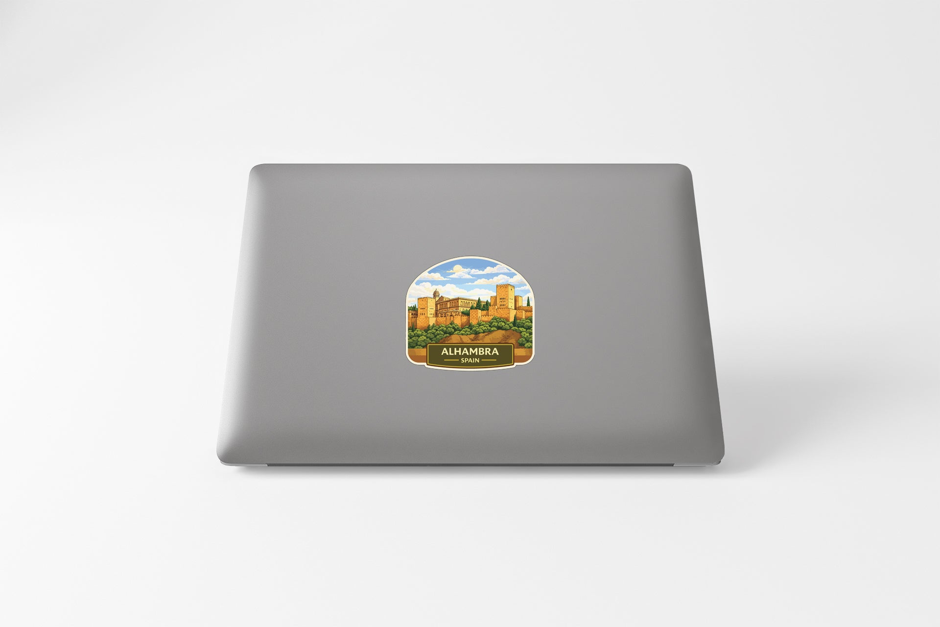 a sticker of a cityscape on the back of a laptop.