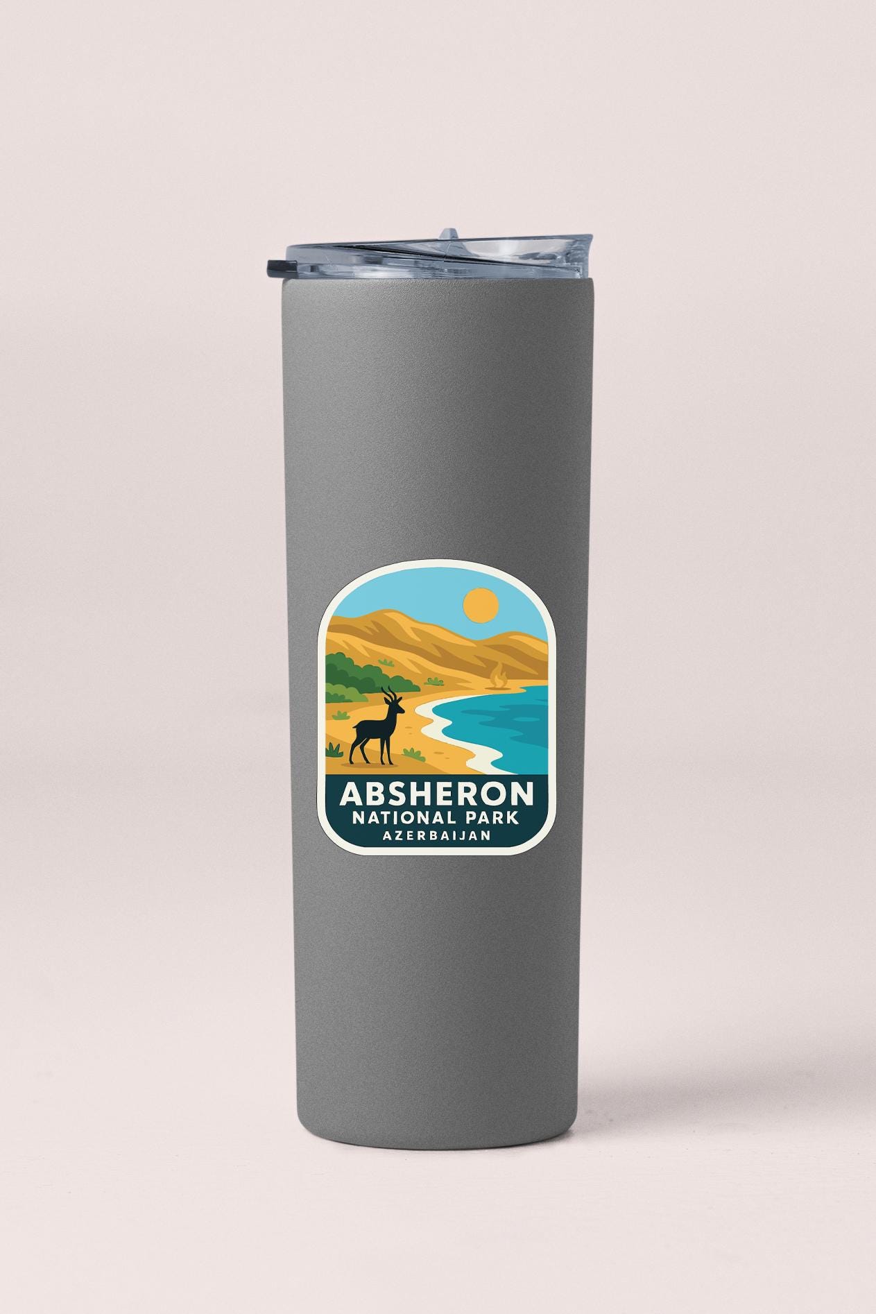 A gray insulated tumbler with a label that says "ABSHERON NATIONAL PARK AZERBAJAN".